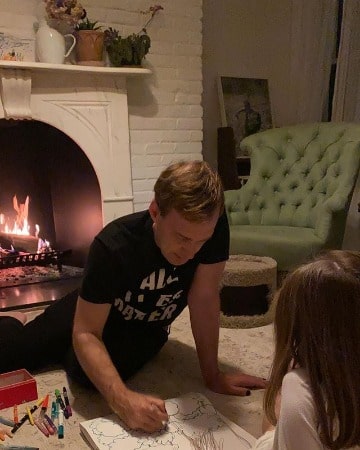 Picture of Caroline Estabrook with her father Dan Estabrook drawing an image